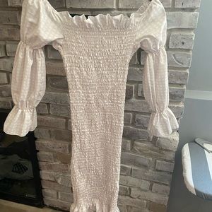 Never worn maternity dress. Plaid suppose to be cream but looks like pink/white!